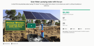 Solar water pump system with solar panels for sustainable energy.