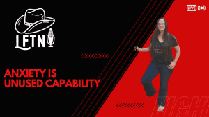 Woman smiling and speaking during a live podcast episode about anxiety and unused capability.