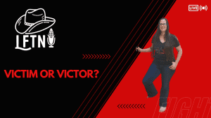 Woman smiling on a podcast stage with "Victim or Victor?" title.